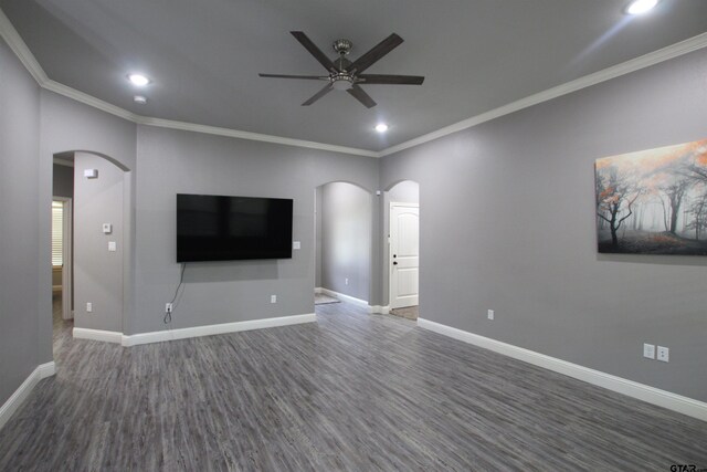 1700 Easy St, Tyler, TX 75703 - unfurnished living room featuring arched walkways, a ceiling fan, crown molding, dark wood-style flooring, and recessed lighting