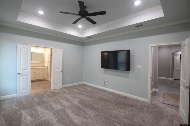 1700 Easy St, Tyler, TX 75703 - unfurnished bedroom featuring a raised ceiling, ornamental molding, carpet floors, recessed lighting, and ensuite bath