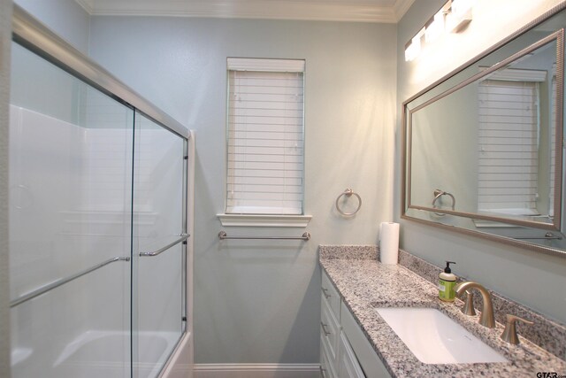 1700 Easy St, Tyler, TX 75703 - full bathroom with vanity, crown molding, and shower / bath combination with glass door