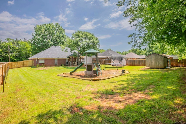 view of yard featuring a playground and a storage shed