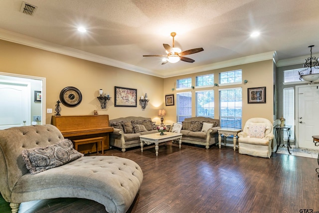 living room featuring a textured ceiling, dark hardwood / wood-style floors, crown molding, and ceiling fan