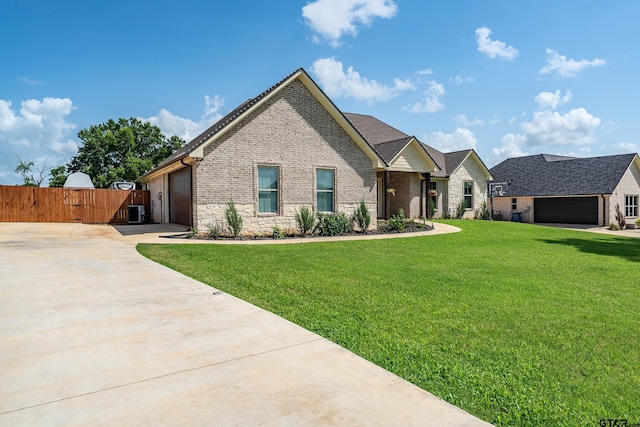 7757 Freestone Dr, Bullard, TX 75757 - view of front of house featuring concrete driveway, an attached garage, brick siding, and a gate