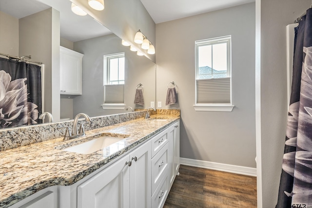7757 Freestone Dr, Bullard, TX 75757 - full bath featuring wood finished floors, double vanity, and a shower with curtain