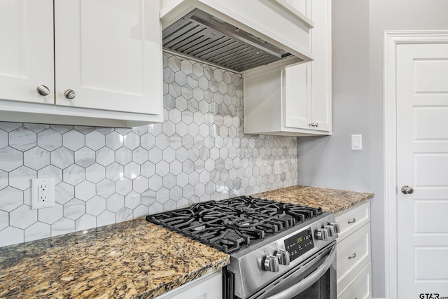 7757 Freestone Dr, Bullard, TX 75757 - kitchen featuring stainless steel range with gas cooktop, wall chimney range hood, backsplash, white cabinetry, and dark stone counters