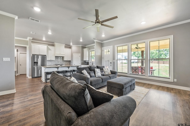 7757 Freestone Dr, Bullard, TX 75757 - living area featuring a ceiling fan, ornamental molding, dark wood-style flooring, and recessed lighting