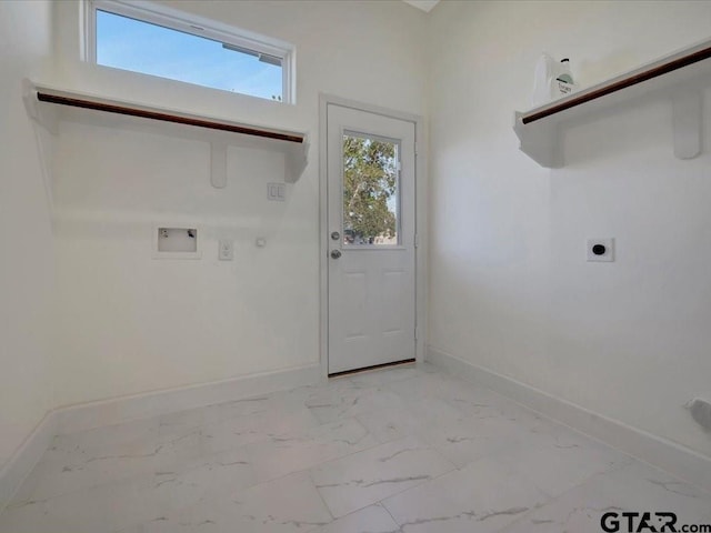 clothes washing area featuring gas dryer hookup, laundry area, baseboards, marble finish floor, and electric dryer hookup