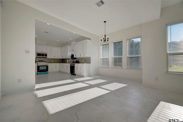 kitchen featuring visible vents, white cabinets, decorative backsplash, marble finish floor, and stainless steel appliances