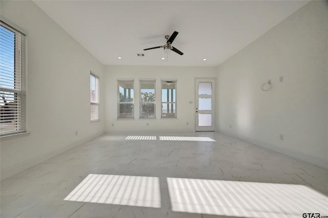 spare room with ceiling fan, visible vents, baseboards, and recessed lighting