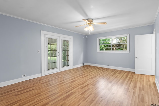 unfurnished room featuring baseboards, ornamental molding, and light wood-type flooring