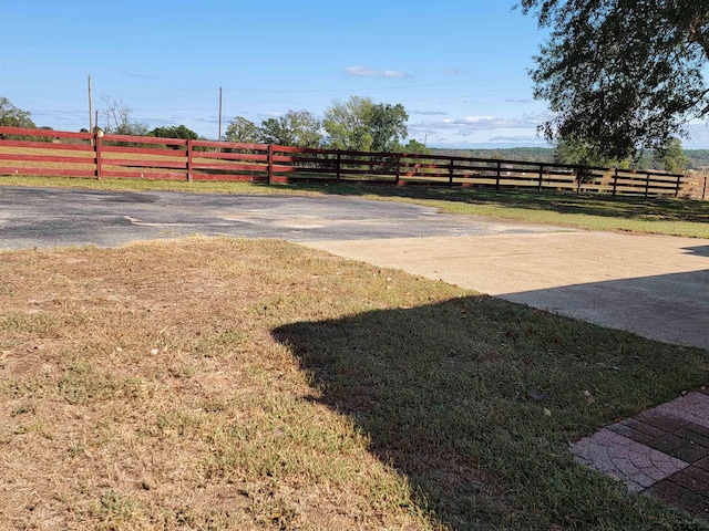 view of yard with a rural view