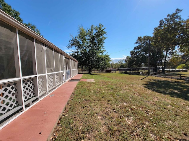 view of yard with a sunroom