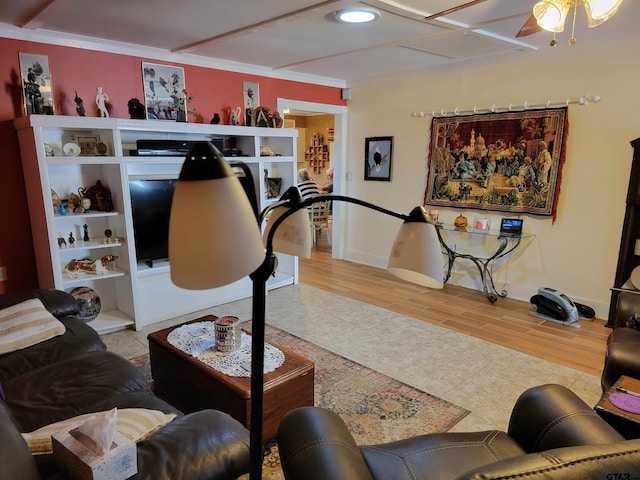 living room featuring ceiling fan, wood-type flooring, and ornamental molding