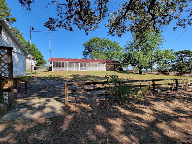 view of yard with a sunroom