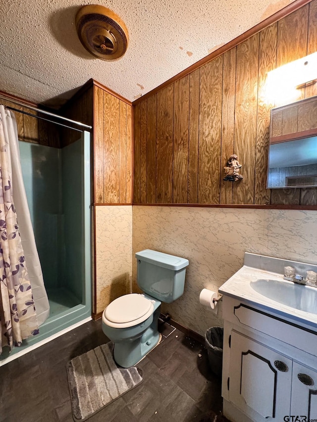 bathroom with wood-type flooring, toilet, curtained shower, a textured ceiling, and vanity