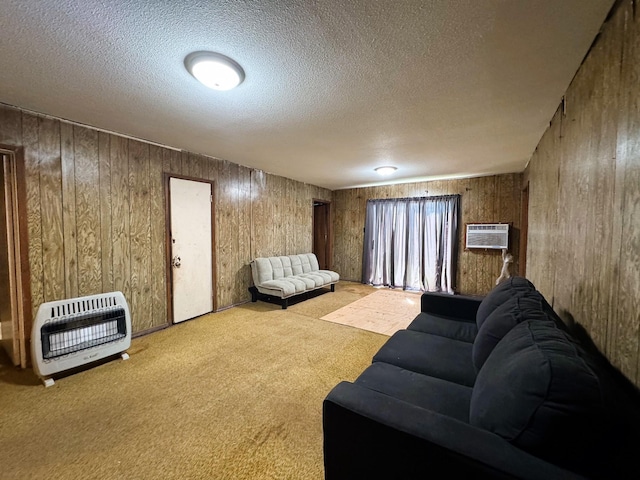 living room featuring a wall mounted air conditioner, a textured ceiling, light carpet, and heating unit