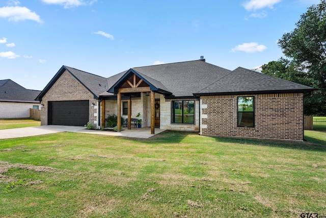 view of front facade featuring a garage and a front lawn