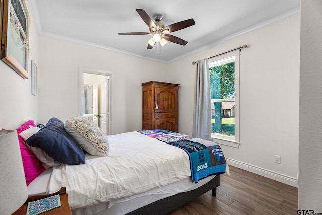 bedroom featuring dark wood-type flooring, ceiling fan, and crown molding