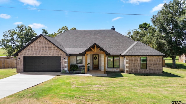 view of front facade with a garage and a front yard