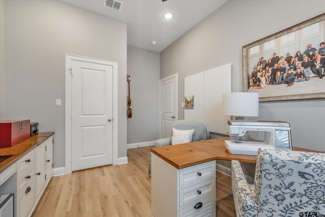 office space with light wood-type flooring, visible vents, baseboards, and recessed lighting