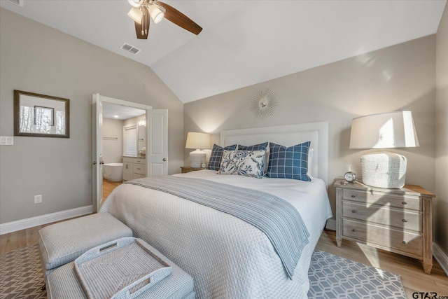 bedroom with baseboards, lofted ceiling, visible vents, and light wood-style flooring