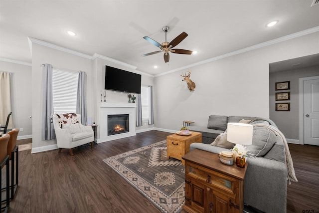 409 Meadow Ln, Chandler, TX 75758 - living room with a ceiling fan, a glass covered fireplace, dark wood-style floors, crown molding, and recessed lighting