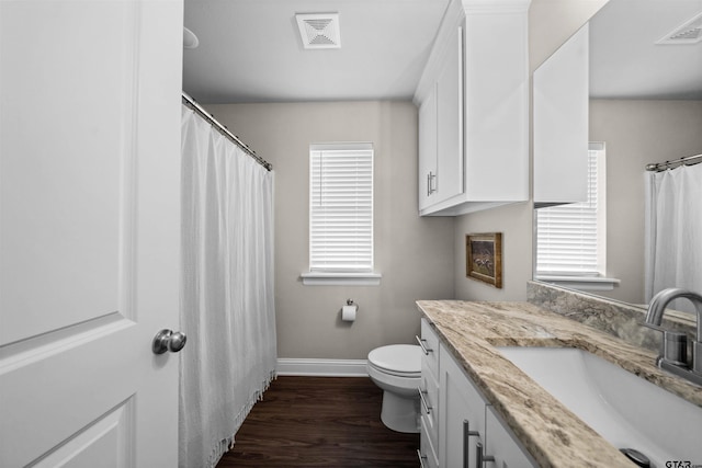409 Meadow Ln, Chandler, TX 75758 - bathroom with plenty of natural light, vanity, wood finished floors, and a shower with shower curtain