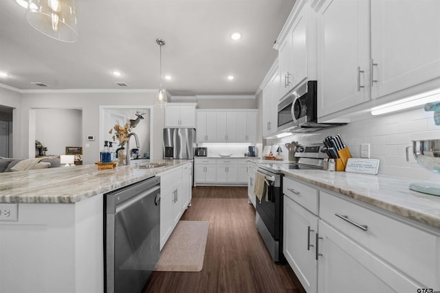 409 Meadow Ln, Chandler, TX 75758 - kitchen with stainless steel appliances, crown molding, white cabinets, tasteful backsplash, and dark wood finished floors
