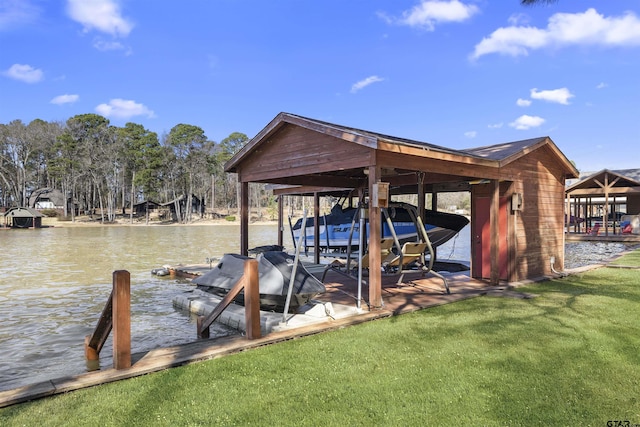 dock area featuring a water view, a yard, and boat lift