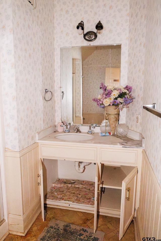 bathroom with sink and tile patterned flooring