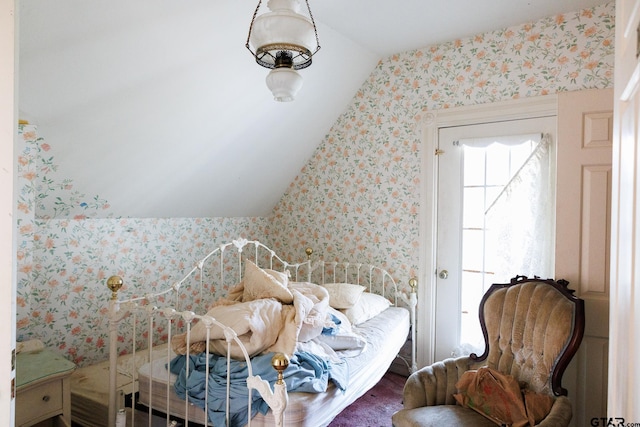 bedroom featuring lofted ceiling