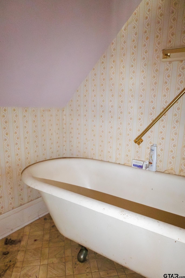 bathroom with a tub to relax in