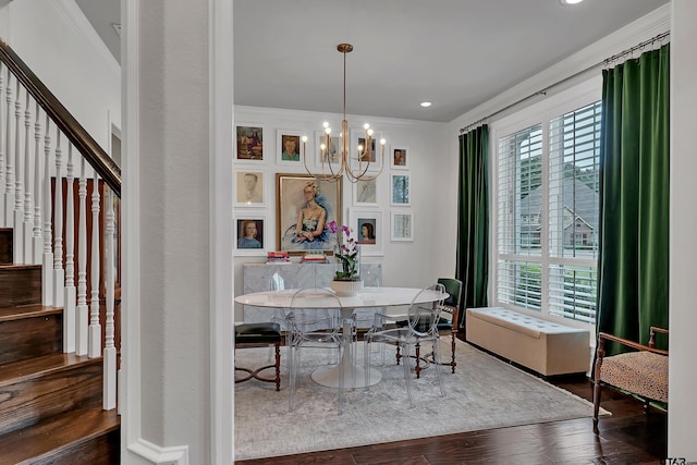 dining room with an inviting chandelier, dark wood-type flooring, and crown molding