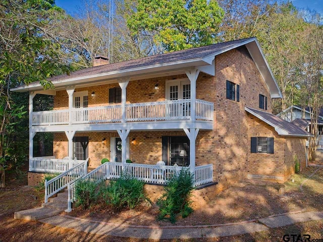 view of front facade with a porch and a balcony