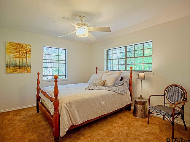 bedroom with ceiling fan and carpet floors