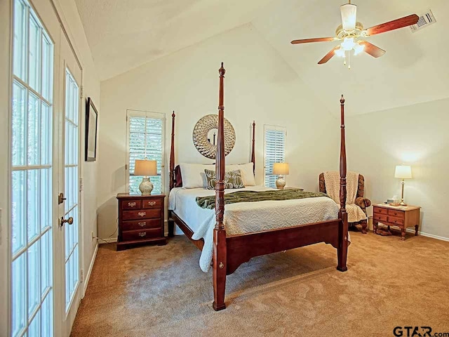 carpeted bedroom featuring vaulted ceiling and ceiling fan