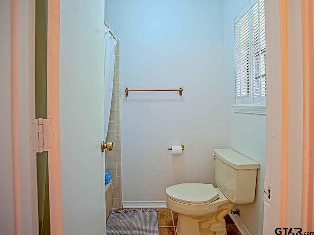 bathroom with tile patterned floors and toilet