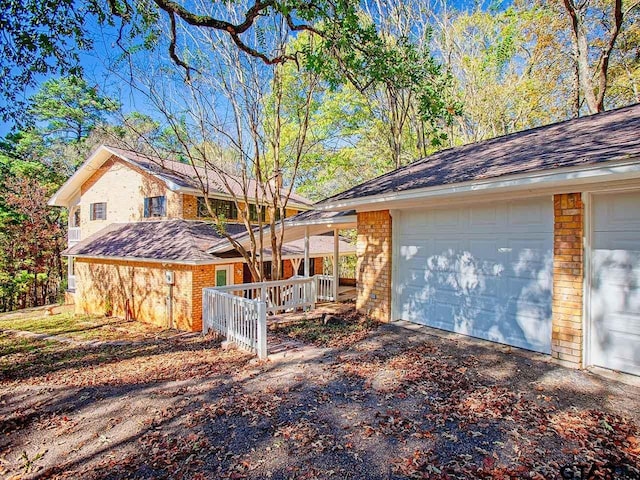 view of side of home featuring a garage