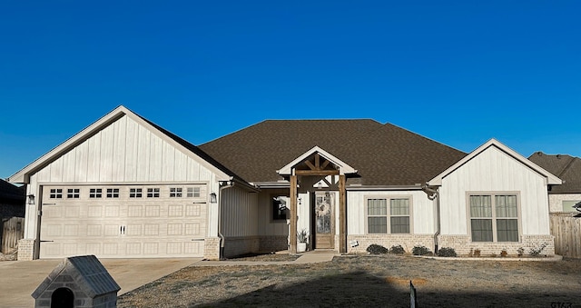 modern inspired farmhouse featuring brick siding, a garage, driveway, and a shingled roof