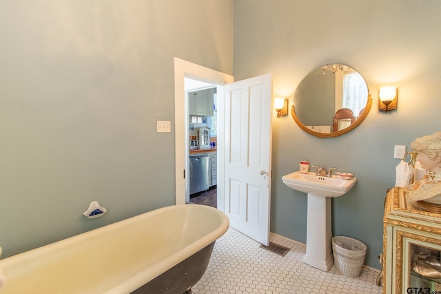 bathroom featuring a bathtub and tile patterned flooring