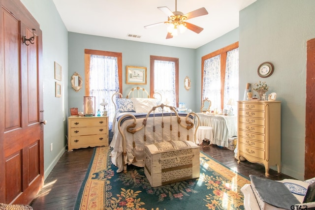 bedroom featuring dark hardwood / wood-style floors and ceiling fan