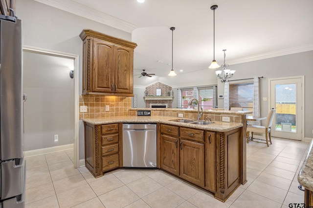 1625 Skidmore Ln, Tyler, TX 75703 - kitchen with stainless steel appliances, a sink, a ceiling fan, a fireplace, and a peninsula