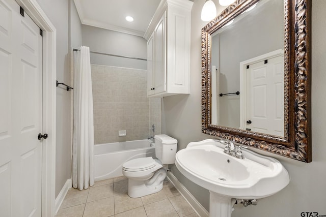 1625 Skidmore Ln, Tyler, TX 75703 - bathroom featuring baseboards, tile patterned floors, toilet, shower / bath combination with curtain, and a sink