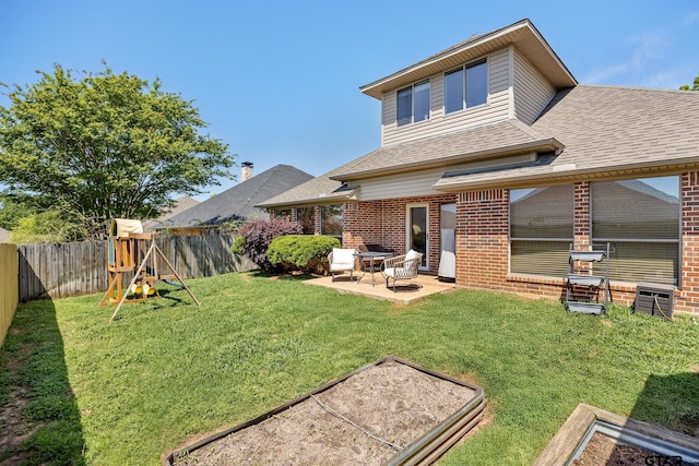 1625 Skidmore Ln, Tyler, TX 75703 - back of house featuring brick siding, a patio, and roof with shingles
