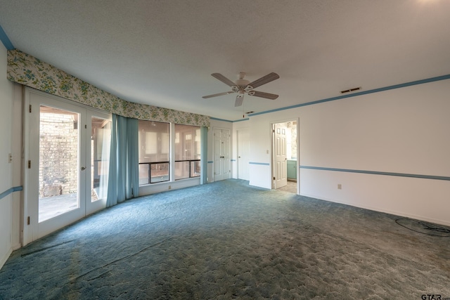 spare room with ceiling fan, french doors, and carpet floors