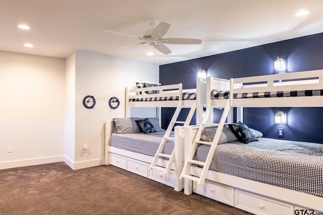 bedroom featuring ceiling fan and dark colored carpet