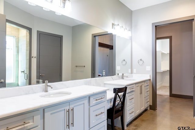 bathroom featuring vanity, walk in shower, and concrete floors