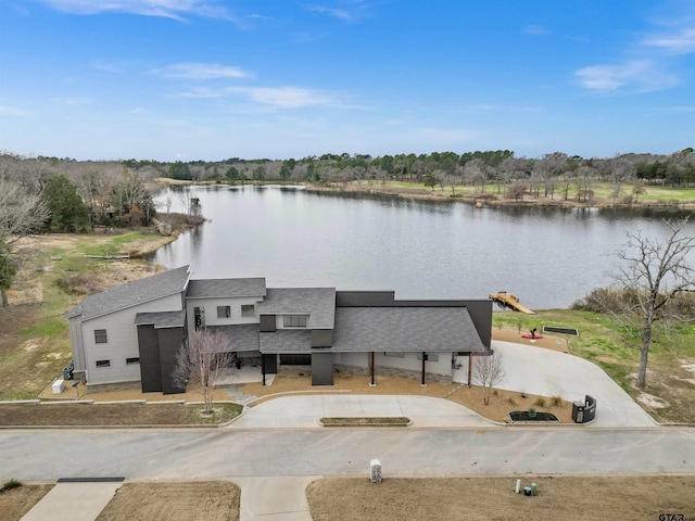 exterior space with a water view