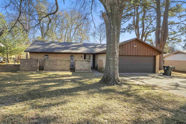 single story home with a garage and a front lawn