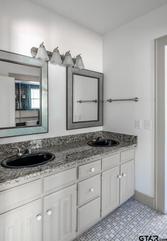 bathroom with vanity and tile patterned floors