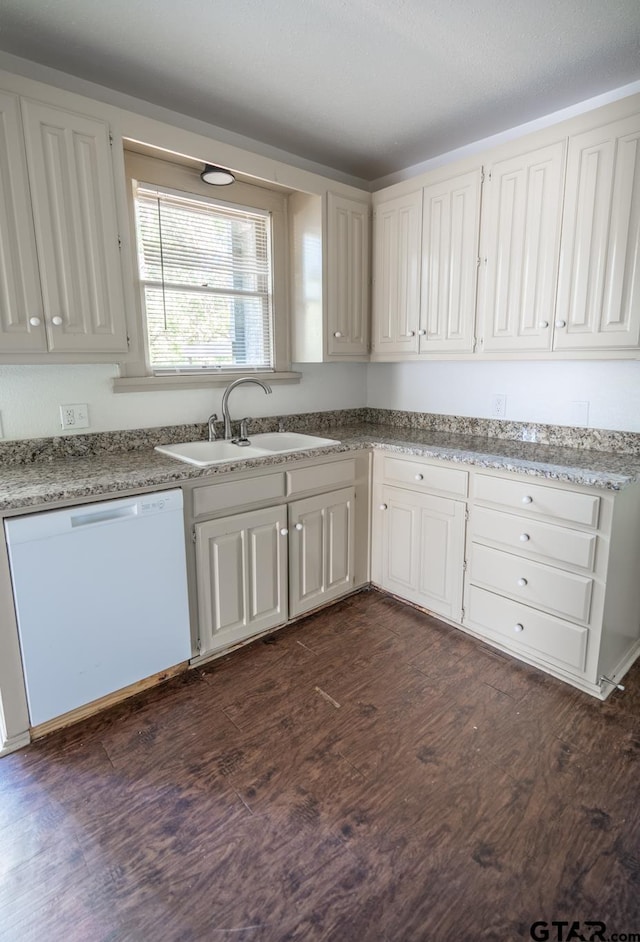 kitchen with white cabinets, sink, dark wood-type flooring, and dishwasher